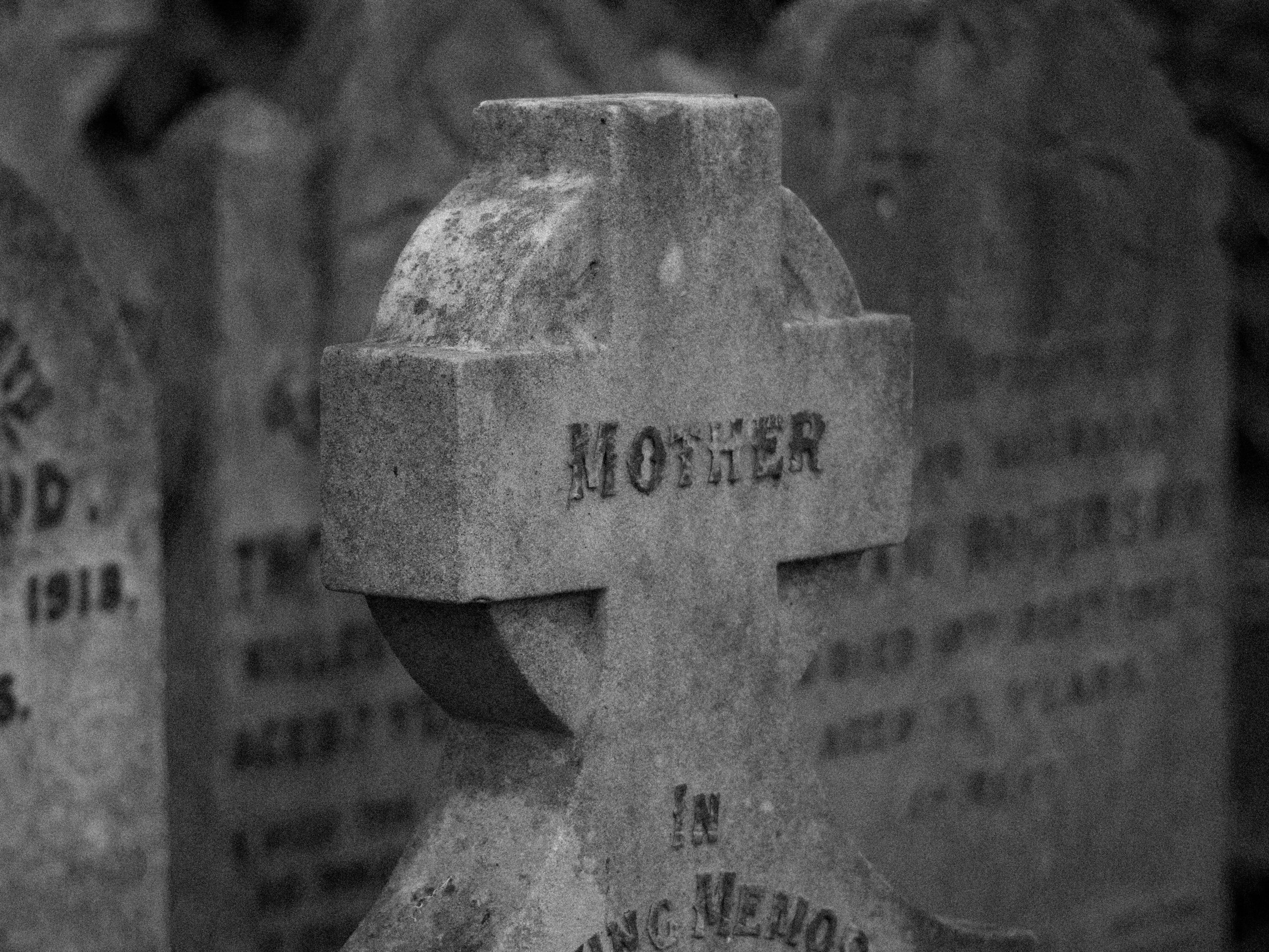 Picture of a tombstone cross that says the word mother
